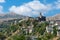 Gjirokastra cityscape in Southern Albania. Old town and Gjirokaster old castle top view. Popular Albanian travel destination