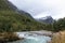 Glacial emerald river in autumn Norway landscape