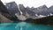 Glacial water of Moraine Lake with mountains and forests, Banff, Canada