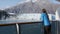 Glacier Bay Alaska cruise ship passenger looking at glacier from balcony