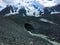 Glacier cave in the mountains moraine. Altai, Russia