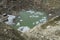 Glacier cracks and ice lake with icebergs