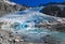 Glacier Feeding Turquoise Alpine Lake.