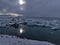 Glacier lake JÃ¶kulsÃ¡rlÃ³n, located in south Iceland in VatnajÃ¶kull national park, with floating icebergs and sun shining.