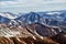 Glacier mountain peaks. Northern landscape. View from helicopter flight altitude