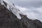 Glacier on rocky mountains. Melting glaciers due to global warming climate change problem. Barskoon mountain pass. Travel tourism