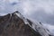 Glacier on rocky mountains. Melting glaciers due to global warming climate change problem. Barskoon mountain pass. Travel tourism