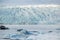 Glacier tongue between the mountains coming into glacial lake, Vatnajokull glacier, Fjallsarlon lagoon, South Iceland