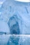 Glacier wall in Antarctica, majestic blue and white ice wall with shape of arch.