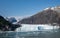 the glacier was falling off the side of the cliff to the side