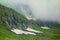 Glacier waterfalls on a hiking trail from Mukhuri to Khaishi via Tobavarchkhili lakes in Georgia