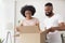 Glad african american millennial couple open box