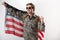 Glad american military young man waving his hand