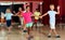 Glad children trying dancing partner dance