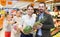 Glad couple with products in fruit department