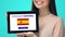 Glad female holding tablet with learn Spanish language app, educational program