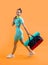 glad fitness woman in sportswear walk with sport bag in studio. fitness woman in workout sportswear