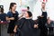 Glad hairdresser cutting female client