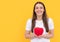 glad lady in white shirt with heart on yellow background, charity
