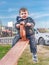 Ð glad little boy on a teetertotter