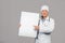 Glad mature chinese male therapist in white coat with stethoscope hold banner with copy space