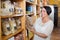 Glad mature woman customer holding with cereal