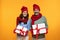 Glad senior european wife in hat and husband hold gift box at winter