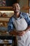 Glad to see you support the best cafe again. Portrait of a young business owner standing in his bakery.