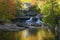 Glade Creek Grist Mil and autumn reflections and water fall in Babcock State Park, WV