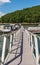 Glade Township, Pennsylvania, USA August 3, 2021 A metal walkway leading to docks at the Kinzua Wolf Run Marina in the Allegheny N