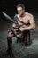 Gladiator with sword kneeling