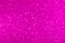 Glamor pink sparkling background. Blured glitter background. Holiday abstract texture. Background of blue lights.