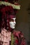 Glamorous and elegant woman performer with venetian mask during venice carnival