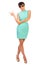 Glamorous girl in turquoise dress shows pointing gesture