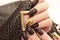 Glamorous luxurious brown crocodile manicure.