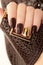 Glamorous luxurious brown crocodile manicure.