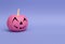 Glamorous pink pumpkin for Halloween on a purple background