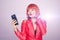 Glamorous redhead woman making selfie on smart phone