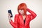 Glamorous redhead woman making selfie on smart phone