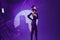 glamorous woman posing on stage spotlight silhouette disco color background unaltered