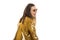 Glamorous young lady in the Golden jacket looks away and laughs