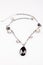 Glamour fashion necklace homemade jewelry black stone under white background