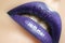 Glamour Gloss Lip Make-up. Fashion Makeup Beauty Shot. Close-up full Lips with celebrate Purple Lipgloss