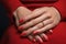 Glamour woman hand with classic red nail polish on her fingernails. Red nail manicure with gel polish at luxury beauty salon. Nail