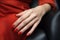 Glamour woman hand with classic red nail polish on her fingernails. Red nail manicure with gel polish at luxury beauty salon. Nail