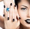 Glamour woman\'s nails , lips and eyes painted color black.