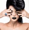 Glamour woman\'s nails , lips and eyes painted color black.