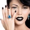 Glamour woman\'s nails , lips and eyes painted color black.