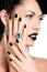 Glamour woman\'s nails , lips and eyes painted color black.