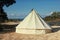 Glamping campsite near the sea. Big camping tent for luxury outdoor vacation